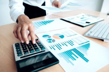 man-planning-business-account-with-analytics-report
